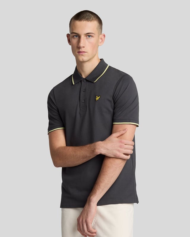 When people think of Lyle & Scott, they often think of polo shirts, so it stands to reason that we create the best polo shirts season after season. This one is cut for a classic fit in cotton jersey with a bit of added stretch and is finished with contrast tipping at the collar and cuffs for a slightly preppy look. - Classic collar 
- Front button fastening 
- Short sleeves 
- Tipped collar and cuffs
- Composition: 97% cotton, 3% elastane