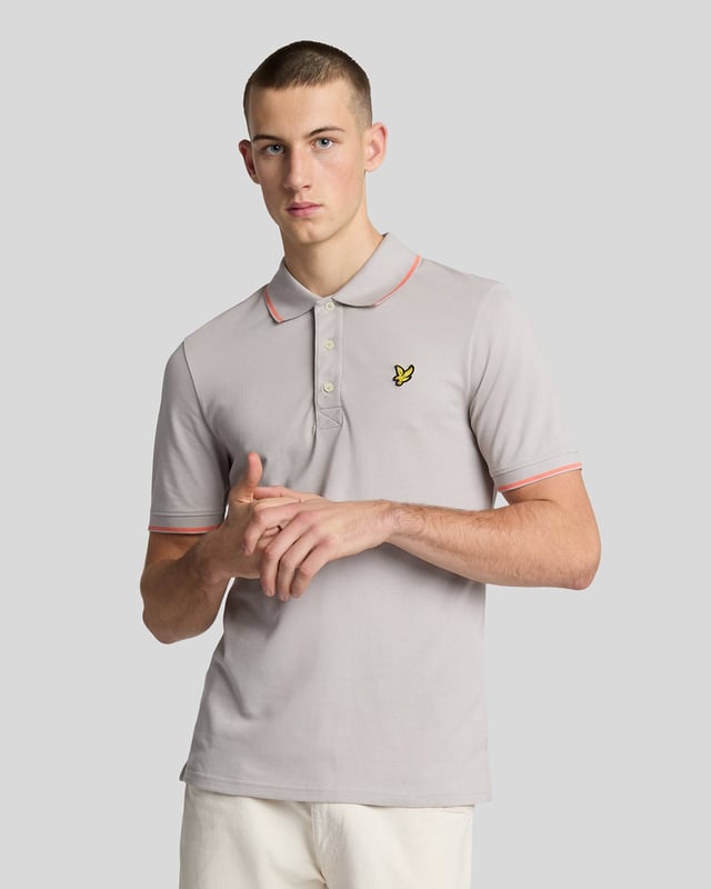 When people think of Lyle & Scott, they often think of polo shirts, so it stands to reason that we create the best polo shirts season after season. This one is cut for a classic fit in cotton jersey with a bit of added stretch and is finished with contrast tipping at the collar and cuffs for a slightly preppy look. - Classic collar 
- Front button fastening 
- Short sleeves 
- Tipped collar and cuffs
- Composition: 97% cotton, 3% elastane
