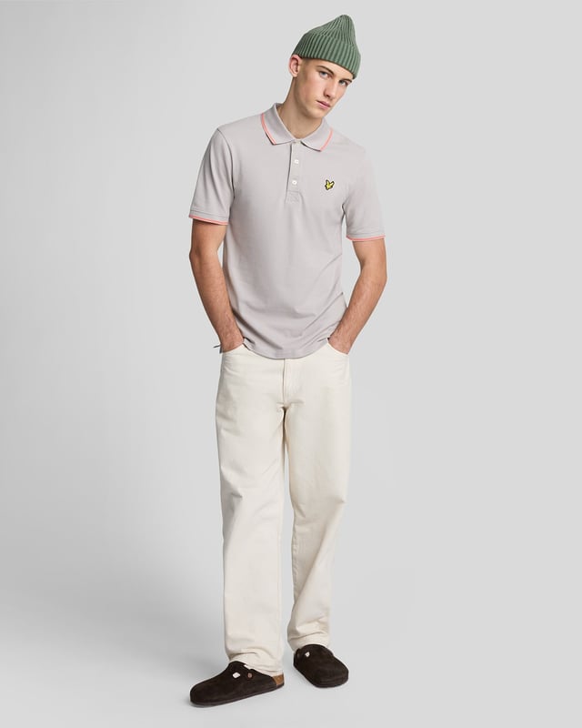 When people think of Lyle & Scott, they often think of polo shirts, so it stands to reason that we create the best polo shirts season after season. This one is cut for a classic fit in cotton jersey with a bit of added stretch and is finished with contrast tipping at the collar and cuffs for a slightly preppy look. - Classic collar 
- Front button fastening 
- Short sleeves 
- Tipped collar and cuffs
- Composition: 97% cotton, 3% elastane