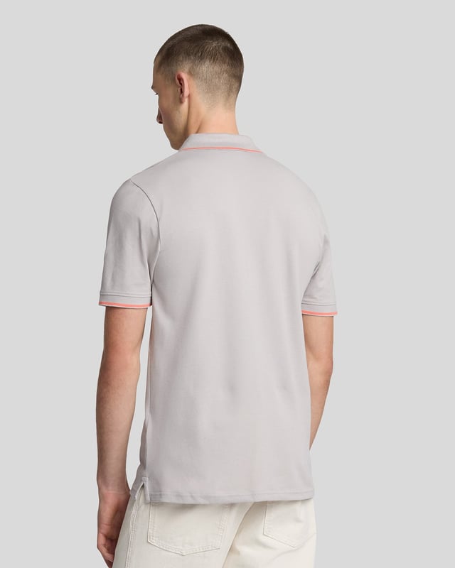 When people think of Lyle & Scott, they often think of polo shirts, so it stands to reason that we create the best polo shirts season after season. This one is cut for a classic fit in cotton jersey with a bit of added stretch and is finished with contrast tipping at the collar and cuffs for a slightly preppy look. - Classic collar 
- Front button fastening 
- Short sleeves 
- Tipped collar and cuffs
- Composition: 97% cotton, 3% elastane