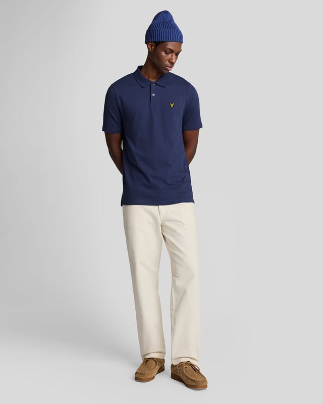 Introducing the Crepe Polo Shirt, a pinnacle of sophistication in our Spring menswear collection. This elegant piece features a refined relaxed fit and is crafted from a luxurious blend of 98% cotton and 2% elastane, ensuring ultimate comfort and mobility. Thoughtfully designed with a two-button placket and adorned with the distinctive Golden Eagle tab on the left chest, this polo exemplifies timeless style and versatility.

- Composition: 98% Cotton, 2% Elastane
- Fit: Relaxed
- Logo Branding: Golden Eagle tab
- Logo Placement: Left chest
- Versatile styling for casual and semi-formal occasions

Elevate your wardrobe with this sophisticated polo, perfect for the discerning gentleman this spring.