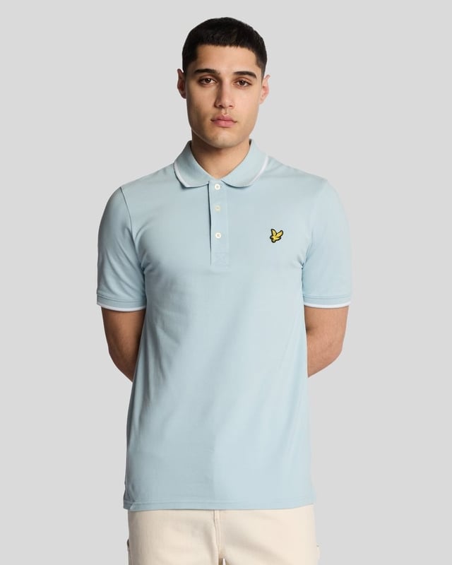 When people think of Lyle & Scott, they often think of polo shirts, so it stands to reason that we create the best polo shirts season after season. This one is cut for a classic fit in cotton jersey with a bit of added stretch and is finished with contrast tipping at the collar and cuffs for a slightly preppy look. - Classic collar 
- Front button fastening 
- Short sleeves 
- Tipped collar and cuffs
- Composition: 97% cotton, 3% elastane