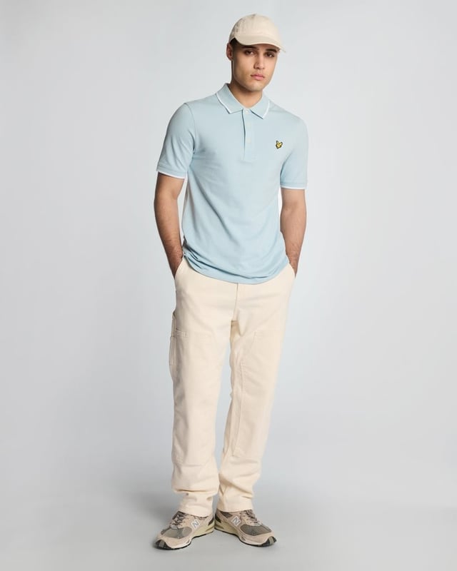 When people think of Lyle & Scott, they often think of polo shirts, so it stands to reason that we create the best polo shirts season after season. This one is cut for a classic fit in cotton jersey with a bit of added stretch and is finished with contrast tipping at the collar and cuffs for a slightly preppy look. - Classic collar 
- Front button fastening 
- Short sleeves 
- Tipped collar and cuffs
- Composition: 97% cotton, 3% elastane