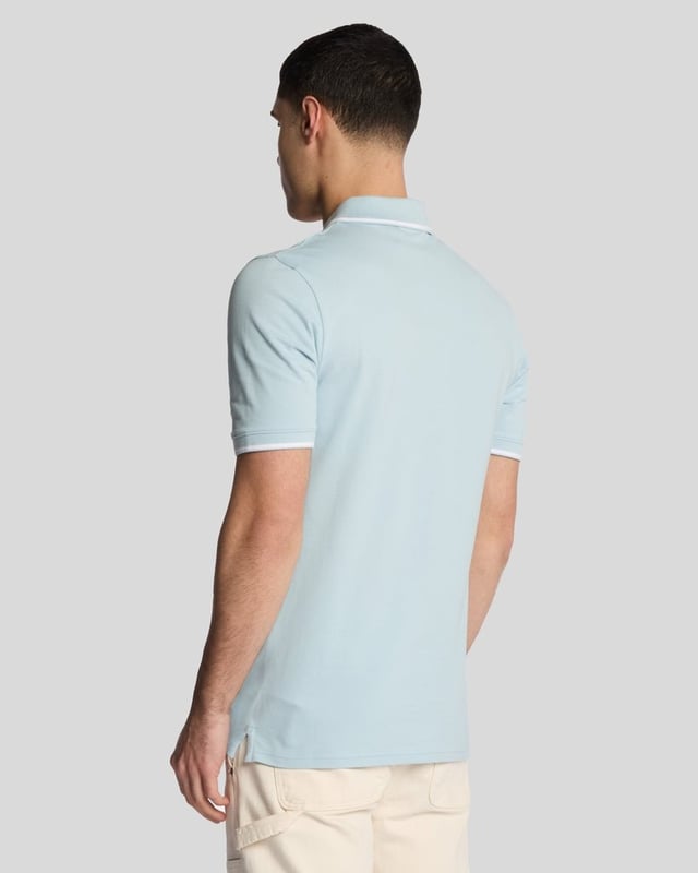 When people think of Lyle & Scott, they often think of polo shirts, so it stands to reason that we create the best polo shirts season after season. This one is cut for a classic fit in cotton jersey with a bit of added stretch and is finished with contrast tipping at the collar and cuffs for a slightly preppy look. - Classic collar 
- Front button fastening 
- Short sleeves 
- Tipped collar and cuffs
- Composition: 97% cotton, 3% elastane