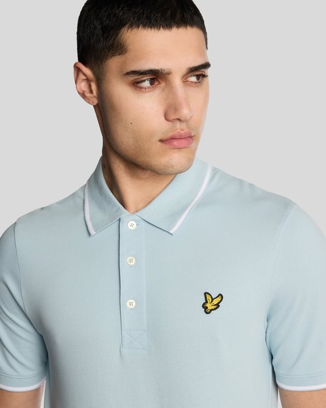 When people think of Lyle & Scott, they often think of polo shirts, so it stands to reason that we create the best polo shirts season after season. This one is cut for a classic fit in cotton jersey with a bit of added stretch and is finished with contrast tipping at the collar and cuffs for a slightly preppy look. - Classic collar 
- Front button fastening 
- Short sleeves 
- Tipped collar and cuffs
- Composition: 97% cotton, 3% elastane