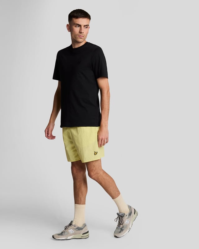 Finished with our signature Golden Eagle, these mesh-lined plain swim shorts, with fast-drying fabric, deliver the iconic Lyle & Scott style both in and out of the pool.