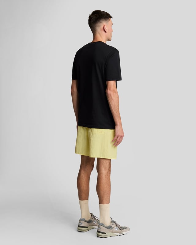 Finished with our signature Golden Eagle, these mesh-lined plain swim shorts, with fast-drying fabric, deliver the iconic Lyle & Scott style both in and out of the pool.