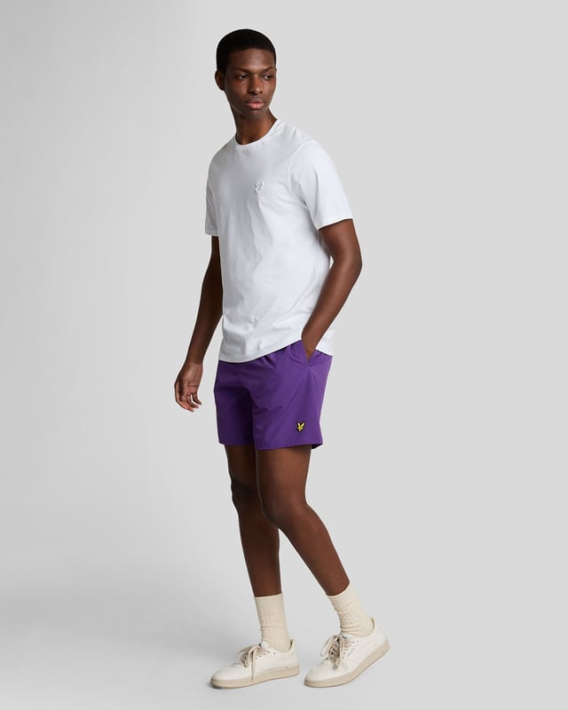 Finished with our signature Golden Eagle, these mesh-lined plain swim shorts, with fast-drying fabric, deliver the iconic Lyle & Scott style both in and out of the pool.