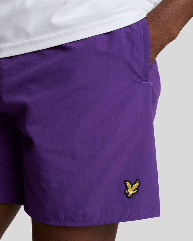 Finished with our signature Golden Eagle, these mesh-lined plain swim shorts, with fast-drying fabric, deliver the iconic Lyle & Scott style both in and out of the pool.