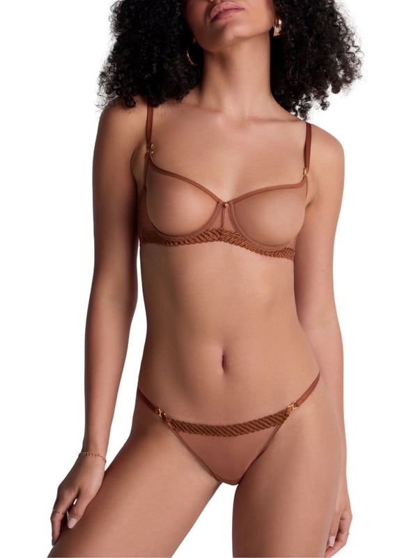 Aubade Sheer Emotion Half Cup Bra. Underwired demi cup bra with sheer mesh tulle, shaped moulded cups, and intricate embroidery. Matching briefs available. This item is recommended for hand wash only.
