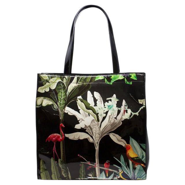 Adorned with a glossy topical print, this tote offers a stylish and unique touch to your everyday look. With matching purse that provides multiple compartments, this bag set will be a talking statement piece. This set would be perfect for gifting or treating yourself.
Colour: Black.
Water Resistant.
Vinyl PU/Polyester.
Bag: L x H x W = 34cm x 34cm x 9cm.
Purse: L x W x D = 19cm x 10cm x 2.5cm.
SKU: HB346102.