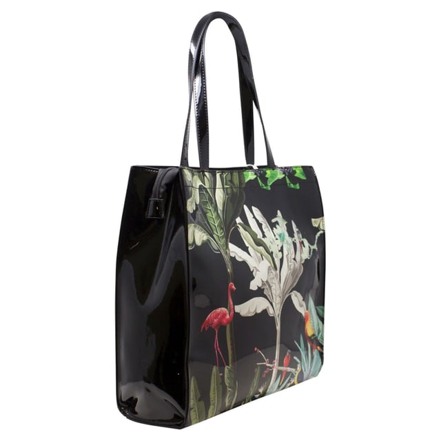 Adorned with a glossy topical print, this tote offers a stylish and unique touch to your everyday look. With matching purse that provides multiple compartments, this bag set will be a talking statement piece. This set would be perfect for gifting or treating yourself.
Colour: Black.
Water Resistant.
Vinyl PU/Polyester.
Bag: L x H x W = 34cm x 34cm x 9cm.
Purse: L x W x D = 19cm x 10cm x 2.5cm.
SKU: HB346102.