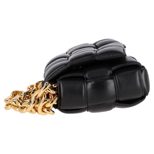 VINTAGE, RRP AS NEW
The Bottega Veneta Chain Cassette Bag in black leather is a masterclass in bold sophistication. Showcasing the house’s signature maxi Intrecciato weave, this standout piece is crafted from plush padded leather and features a chunky gold-finish chain strap that doubles as jewelry. The interior is lined with bonded lambskin and includes a single zipped pocket for essentials, while a metal closure ensures a seamless finish. Equal parts iconic and innovative.


Bottega Veneta Chain Cassette Bag in Black Leather
Condition: Excellent
Signs of wear: No retail tag, No visible sign of wear., 
Packaging: Dust bag
Color: black
Material: Leather | leather
Size: One Size | One Size
Measurements: Width: 80; Height: 180; Length: 250
SKU: NAPPUGBBA494828W