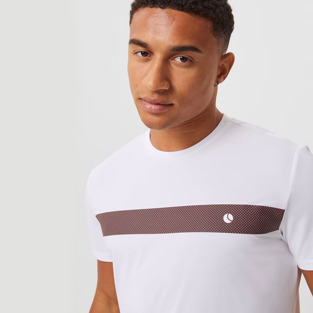Ace Light T-shirt - Performance and Comfort in Motion: Upgrade your athletic wear with the Björn Borg Ace Light T-shirt, crafted for those who prioritize performance and comfort. Made from soft, recycled polyester, this lightweight tee offers a regular fit and enhanced breathability, making it perfect for high-energy activities. Its classic design is complemented by a ribbed round neck and the iconic Borg logo on the chest. Extra Product Details:. 100% Recycled Polyester Regular Fit Breathable Fabric Ribbed Round Neck Machine Washable. This T-shirt is the perfect combination of style, comfort, and sustainability, ideal for any workout routine.