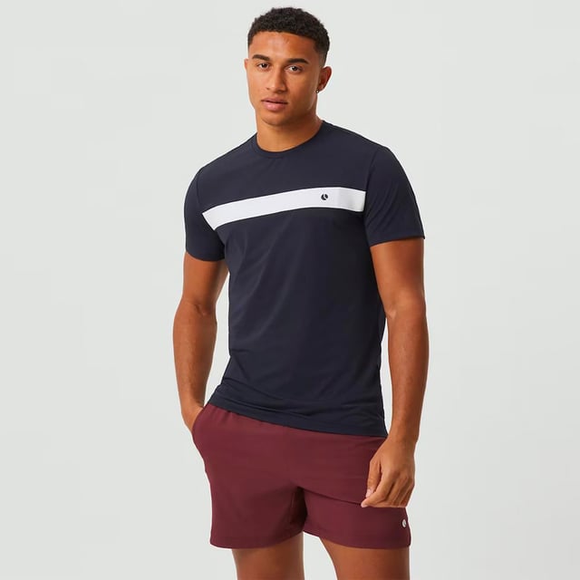 Ace Light T-shirt - Performance and Comfort in Motion: Upgrade your athletic wear with the Björn Borg Ace Light T-shirt, crafted for those who prioritize performance and comfort. Made from soft, recycled polyester, this lightweight tee offers a regular fit and enhanced breathability, making it perfect for high-energy activities. Its classic design is complemented by a ribbed round neck and the iconic Borg logo on the chest. Extra Product Details:. 100% Recycled Polyester Regular Fit Breathable Fabric Ribbed Round Neck Machine Washable. This T-shirt is the perfect combination of style, comfort, and sustainability, ideal for any workout routine.