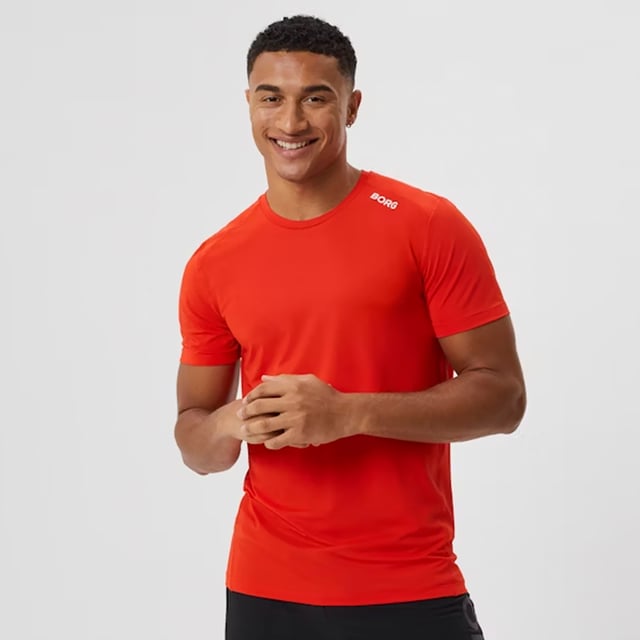 Borg Athletic T-shirt - High-Performance Activewear: Train in ultimate comfort with the Björn Borg Borg Athletic T-shirt, designed for peak performance. Made from lightweight, recycled polyester stretch, this T-shirt offers high moisture-wicking functionality and breathability, ensuring you stay dry and cool during intense workouts. It features a regular fit with strategically placed cutlines to minimize pressure on the shoulders and sides, making it ideal for all types of physical activity. Extra Product Details:. 93% Recycled Polyester, 7% Elastane Moisture-Wicking Fabric High Breathability Strategic Cutlines for Comfort Machine Washable. This T-shirt combines sustainability with top-notch performance, making it a must-have for any fitness enthusiast.