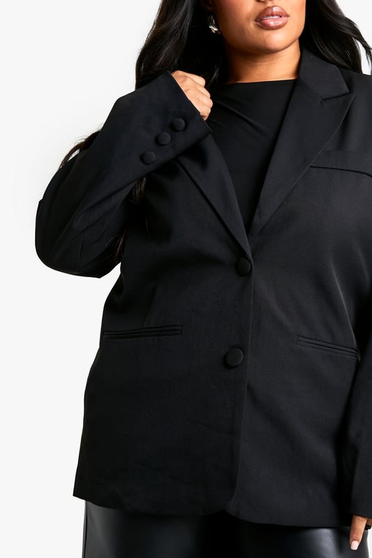 Oversized fit for a relaxed and contemporary silhouette
        Single-breasted design with notched lapels
        Long sleeves with button cuffs for a polished finish
        Front button closure for easy wear
        Versatile plus-size option suitable for various occasions
    
    Make a bold statement with this oversized blazer, perfect for the fashion-forward woman who loves to stay on-trend. The relaxed fit offers comfort without compromising on style, making it an ideal choice for both casual outings and semi-formal events. Pair it with wide-leg trousers and a simple top for a chic office look, or throw it over a bodycon dress for a night out with the girls. The single-breasted design and notched lapels add a touch of classic tailoring to this contemporary piece. Whether you're heading to a family gathering or a casual lunch date, this blazer will effortlessly elevate your ensemble. Its versatility allows for endless styling options - belt it for a more defined silhouette or leave it open for a laid-back vibe. This Boohoo blazer is your go-to piece for creating looks that radiate confidence and style.