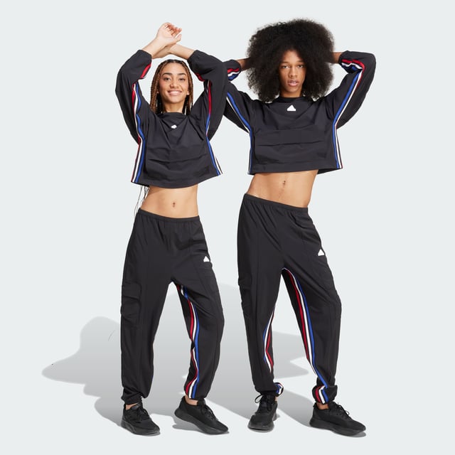 Express All Gender Breaking Cargo Pants Hit the streets with boundless confidence in these adidas pants. Designed for free movement, the stretchy woven fabric moves as you do, whether you're learning the latest dance trends, exploring the city or simply being yourself. AEROREADY technology helps keep you dry even as you push your limits. Cargo pockets carry the necessities while the partially lined interior offers extra comfort. Graphic 3-Stripes on the inseam let your style icon status be known. For those who forge their own path, these lightweight pants are your co-conspirator in self-expression.This product is made with at least 70% recycled materials. By reusing materials that have already been created, adidas help to reduce waste and our reliance on finite resources and reduce the footprint of the products adidas make. -