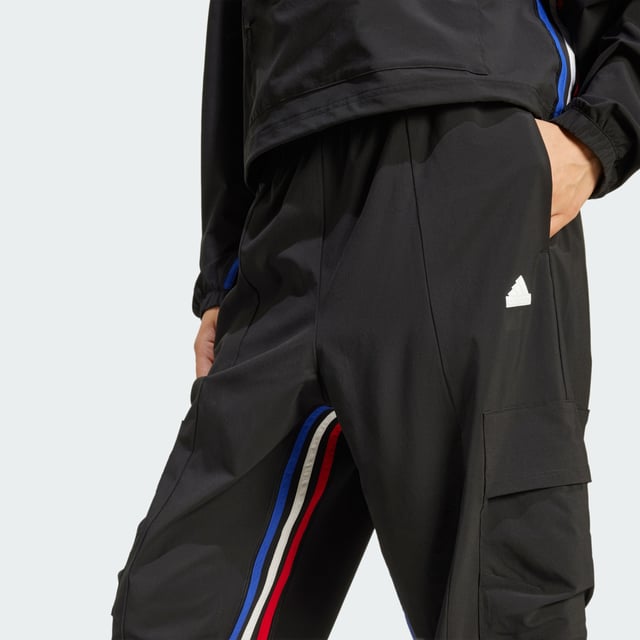 Express All Gender Breaking Cargo Pants Hit the streets with boundless confidence in these adidas pants. Designed for free movement, the stretchy woven fabric moves as you do, whether you're learning the latest dance trends, exploring the city or simply being yourself. AEROREADY technology helps keep you dry even as you push your limits. Cargo pockets carry the necessities while the partially lined interior offers extra comfort. Graphic 3-Stripes on the inseam let your style icon status be known. For those who forge their own path, these lightweight pants are your co-conspirator in self-expression.This product is made with at least 70% recycled materials. By reusing materials that have already been created, adidas help to reduce waste and our reliance on finite resources and reduce the footprint of the products adidas make. -