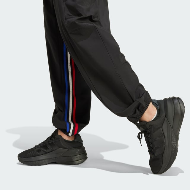 Express All Gender Breaking Cargo Pants Hit the streets with boundless confidence in these adidas pants. Designed for free movement, the stretchy woven fabric moves as you do, whether you're learning the latest dance trends, exploring the city or simply being yourself. AEROREADY technology helps keep you dry even as you push your limits. Cargo pockets carry the necessities while the partially lined interior offers extra comfort. Graphic 3-Stripes on the inseam let your style icon status be known. For those who forge their own path, these lightweight pants are your co-conspirator in self-expression.This product is made with at least 70% recycled materials. By reusing materials that have already been created, adidas help to reduce waste and our reliance on finite resources and reduce the footprint of the products adidas make. -