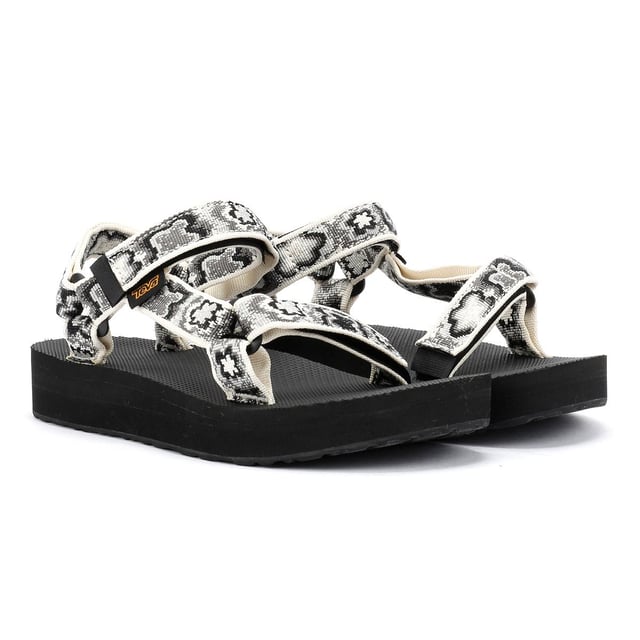 Der Midform Universal liegt genau zwischen dem Flatform Universal und dem Original Universal und erfreut Menschen. Das Obermaterial aus umweltfreundlichem Unifi® Repreve recyceltem Polyester-Webbing ist äußerst strapazierfähig und trocknet schnell nach dem Nasswerden. Das Universal-Befestigungssystem mit Klettverschluss sorgt für einen sicheren Sitz und ein schnelles An- und Ausziehen.