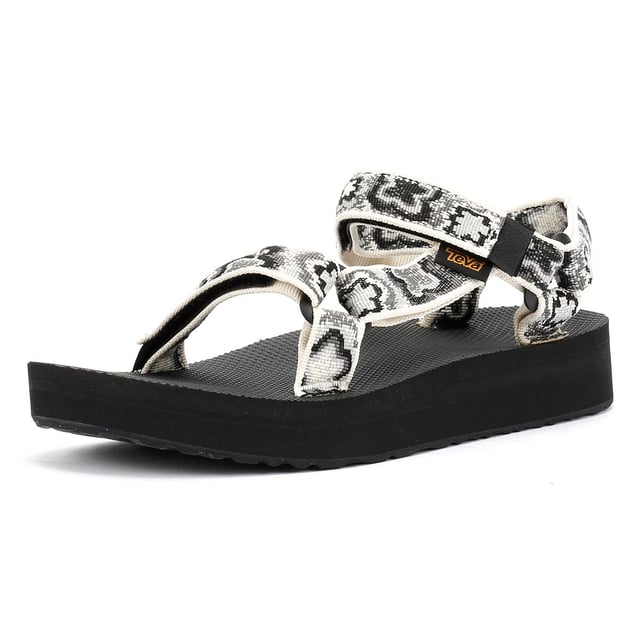 Der Midform Universal liegt genau zwischen dem Flatform Universal und dem Original Universal und erfreut Menschen. Das Obermaterial aus umweltfreundlichem Unifi® Repreve recyceltem Polyester-Webbing ist äußerst strapazierfähig und trocknet schnell nach dem Nasswerden. Das Universal-Befestigungssystem mit Klettverschluss sorgt für einen sicheren Sitz und ein schnelles An- und Ausziehen.