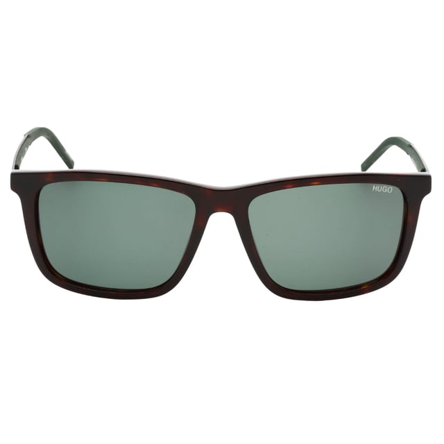 Elevate your style with the Hugo Boss Dark Havana Brown Sunglasses, featuring a sophisticated dark Havana frame paired with green lenses. These sunglasses offer a perfect blend of classic elegance and modern design, providing excellent UV protection while enhancing your visual clarity. Crafted for comfort and durability, they are ideal for daily wear or special occasions. Make a confident statement and protect your eyes with a timeless accessory that complements any outfit effortlessly. Experience the luxury and quality that Hugo Boss is renowned for with these stylish sunglasses. 56X16X145 100% Plastic