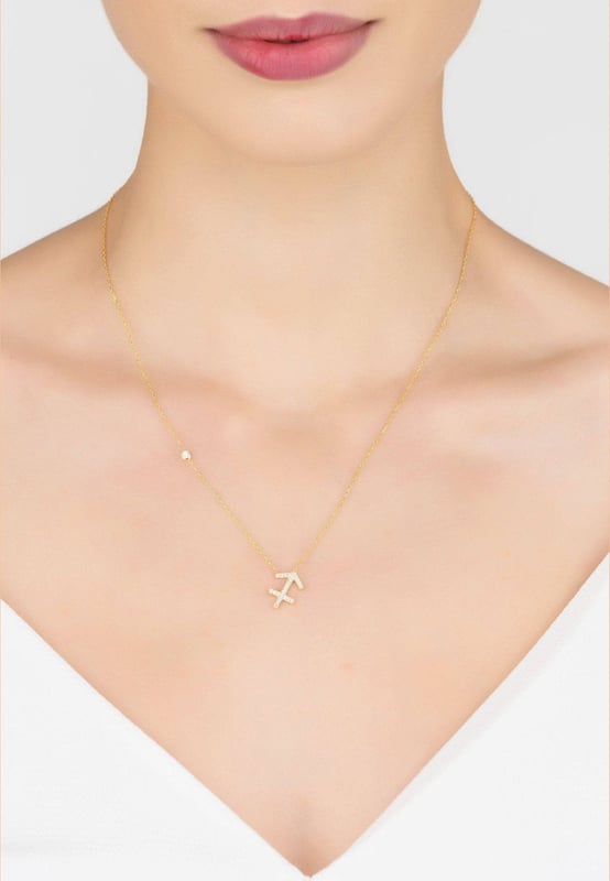 Made of 925 sterling silver, dipped in 22ct gold. This necklace is hand set with multifaceted white zircons.Sagittarius celebrate birthdays November 22 - December 21Finished with a lobster clasp, and size adjusterDimensions: Necklace can be worn 40cm chain length or 45cm chain length using adjuster. Motif 1.5cm x 1cmPackaging:This item is presented in a Latelita London signature packagingCare Instructions:To maintain your jewellery, wipe gently with a damp cloth that is soft and clean. Do not soak in water. Avoid contact with soaps, detergents, perfume or hair spray.