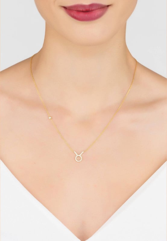 Made of 925 sterling silver, dipped in 22ct gold. This necklace is hand set with multifaceted white zircons.Taurus celebrate birthdays April 20 - May 20Finished with a lobster clasp, and size adjusterDimensions: Necklace can be worn 40cm chain length or 45cm chain length using adjuster. Motif 1.5cm x 1cmPackaging:This item is presented in a Latelita London signature packagingCare Instructions:To maintain your jewellery, wipe gently with a damp cloth that is soft and clean. Do not soak in water. Avoid contact with soaps, detergents, perfume or hair spray.