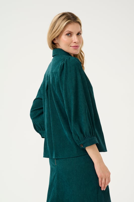 Regular fit,3/4 mouwen  Wassen op 30°, niet bleken, niet in de droger drogen, Druipnat ophangen in de schaduw, warm strijken max. 150° C, Droogreiniging  90% Polyester,8% Polyamide,2% Elastaan