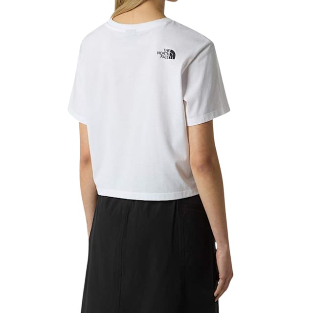 The North Face Women's Simple Dome Cropped Top T-Shirt is a casual, short-sleeved tee perfect for the spring and summer seasons. Made from comfortable cotton material, this pullover shirt features a crew neck and a cropped fit for a stylish look. With its regular fit and stretchy design, this tee from The North Face is easy to care for with machine washable instructions, making it a practical and fashionable choice for any woman's wardrobe.