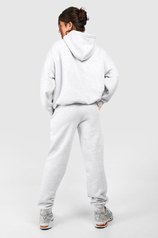 Cosy tracksuit with New York embroidery
        Relaxed fit hoodie with ribbed cuffs and hem
        Matching joggers with tapered leg
        Soft cotton-feel fabric for ultimate comfort
        Versatile two-piece set for effortless styling
    
    Embrace laid-back chic with this petite tracksuit, perfect for those who want to make a statement whilst staying comfortable. The New York embroidery adds a touch of urban flair, making it ideal for city dwellers and travellers alike. Style this set with chunky trainers for a casual day out, or dress it up with statement jewellery and heeled boots for an evening with friends. The versatility of this tracksuit means it can take you from lounging at home to running errands in town with ease. For a sporty look, pair with a baseball cap and crossbody bag. This tracksuit is a must-have for your casual wardrobe, offering both style and comfort for various informal occasions.