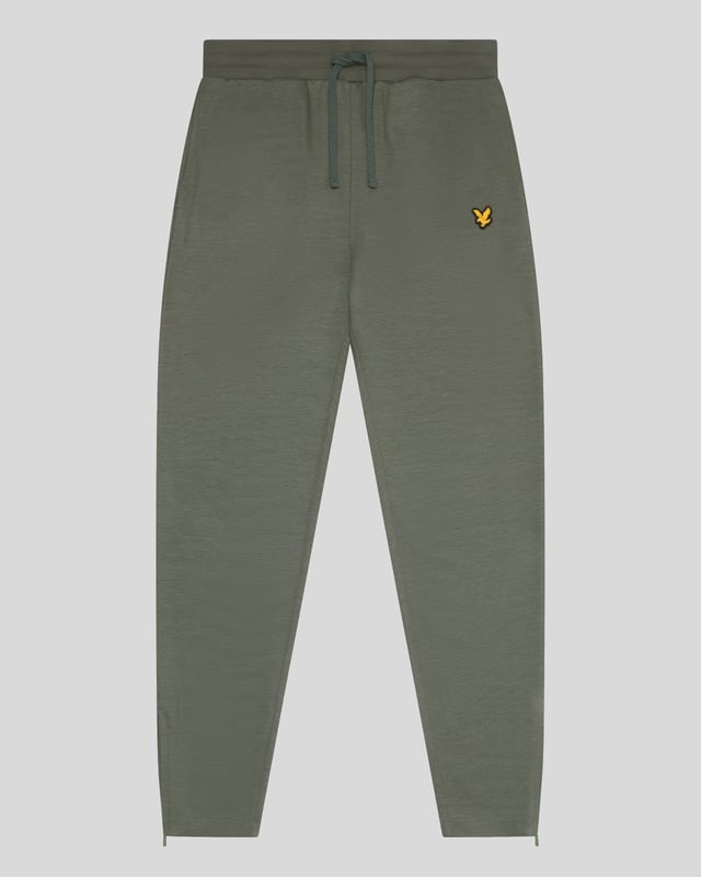 Unsere Fly Fleece Trackies bestehen aus leichter und weicher Viskose und bieten so zusätzliche Dehnbarkeit und Vielseitigkeit, egal ob Sie aktiv sind oder nicht.– 70 % Viskose, 22 % Polyamid, 8 % Elastan– Kordelzug in der Taille– 2 Seitentaschen– 360 g/m² Stoff– Bündchen mit Reißverschluss an den Seitennähten