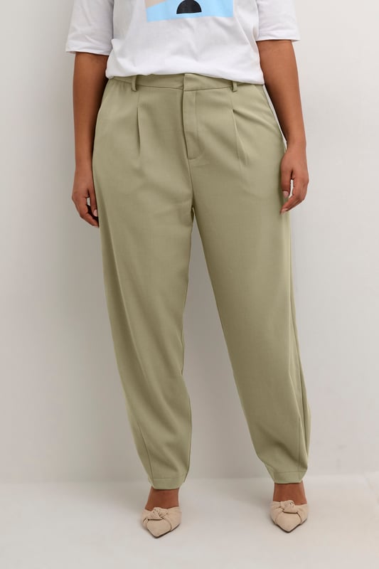 Loose fit,Elastische Taille,Knöchellänge,Tapered  30° waschbar, Nicht bleichen, Nicht im Trockner trocknen, Tropnass aufhängen im Schatten, Kalt bügeln max. 110° C, Trockenreinigung  64% Polyester (Recycelt),33% Viskose,3% Elasthan