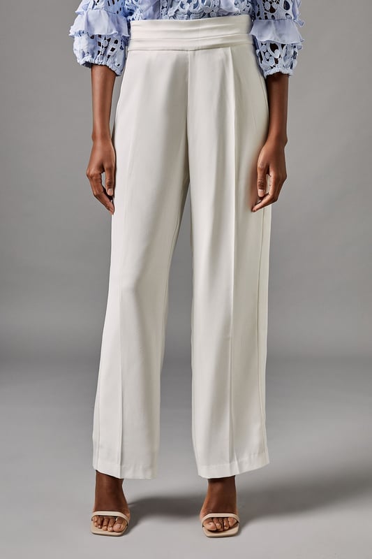 Elegant straight leg trousers with distinctive side panel detailing for a refined silhouette
        Sophisticated high waistband with smooth front pleating for a flattering fit
        Crafted from lightweight crepe fabric offering comfortable movement for all-day wear
        Clean-lined design with subtle side panels that create visual interest and elongate the leg
        Versatile straight cut that pairs beautifully with both fitted and flowing tops
    
    These sophisticated Side Panel Straight Leg Trousers from Coast offer the perfect foundation for your occasion wardrobe. The elegant straight silhouette with distinctive side panel detailing creates a refined look that transitions effortlessly from day to evening events. Style with the textured blue blouse as shown for a coordinated ensemble that commands attention at summer weddings or race day events. For evening occasions, pair with a silk camisole and structured blazer, adding metallic heeled sandals and a clutch bag for a polished finish. The high waistband and front pleating flatter your figure while the straight leg cut offers timeless appeal that works beautifully for formal gatherings. These trousers strike the perfect balance between contemporary design and classic elegance-a true wardrobe investment for the discerning woman.