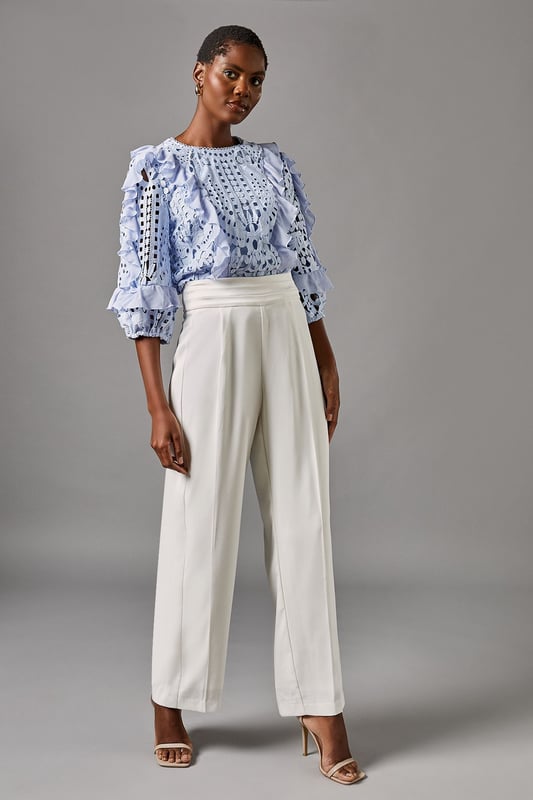 Elegant straight leg trousers with distinctive side panel detailing for a refined silhouette
        Sophisticated high waistband with smooth front pleating for a flattering fit
        Crafted from lightweight crepe fabric offering comfortable movement for all-day wear
        Clean-lined design with subtle side panels that create visual interest and elongate the leg
        Versatile straight cut that pairs beautifully with both fitted and flowing tops
    
    These sophisticated Side Panel Straight Leg Trousers from Coast offer the perfect foundation for your occasion wardrobe. The elegant straight silhouette with distinctive side panel detailing creates a refined look that transitions effortlessly from day to evening events. Style with the textured blue blouse as shown for a coordinated ensemble that commands attention at summer weddings or race day events. For evening occasions, pair with a silk camisole and structured blazer, adding metallic heeled sandals and a clutch bag for a polished finish. The high waistband and front pleating flatter your figure while the straight leg cut offers timeless appeal that works beautifully for formal gatherings. These trousers strike the perfect balance between contemporary design and classic elegance-a true wardrobe investment for the discerning woman.