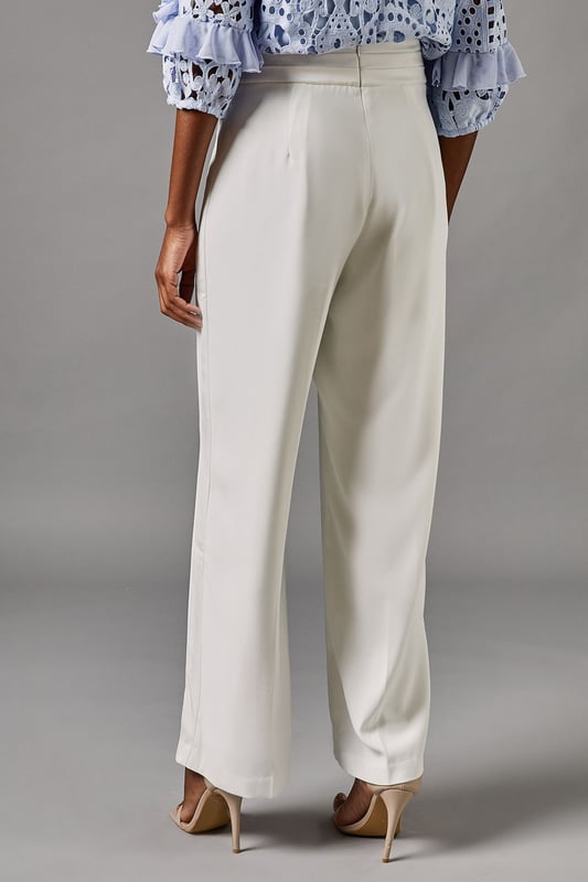 Elegant straight leg trousers with distinctive side panel detailing for a refined silhouette
        Sophisticated high waistband with smooth front pleating for a flattering fit
        Crafted from lightweight crepe fabric offering comfortable movement for all-day wear
        Clean-lined design with subtle side panels that create visual interest and elongate the leg
        Versatile straight cut that pairs beautifully with both fitted and flowing tops
    
    These sophisticated Side Panel Straight Leg Trousers from Coast offer the perfect foundation for your occasion wardrobe. The elegant straight silhouette with distinctive side panel detailing creates a refined look that transitions effortlessly from day to evening events. Style with the textured blue blouse as shown for a coordinated ensemble that commands attention at summer weddings or race day events. For evening occasions, pair with a silk camisole and structured blazer, adding metallic heeled sandals and a clutch bag for a polished finish. The high waistband and front pleating flatter your figure while the straight leg cut offers timeless appeal that works beautifully for formal gatherings. These trousers strike the perfect balance between contemporary design and classic elegance-a true wardrobe investment for the discerning woman.