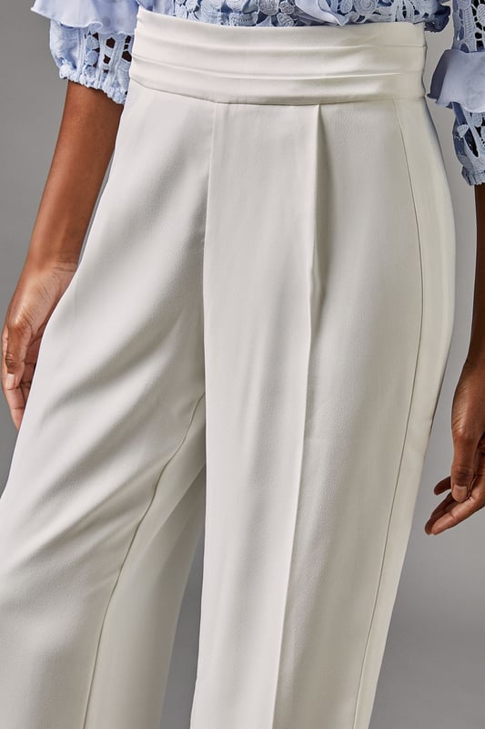 Elegant straight leg trousers with distinctive side panel detailing for a refined silhouette
        Sophisticated high waistband with smooth front pleating for a flattering fit
        Crafted from lightweight crepe fabric offering comfortable movement for all-day wear
        Clean-lined design with subtle side panels that create visual interest and elongate the leg
        Versatile straight cut that pairs beautifully with both fitted and flowing tops
    
    These sophisticated Side Panel Straight Leg Trousers from Coast offer the perfect foundation for your occasion wardrobe. The elegant straight silhouette with distinctive side panel detailing creates a refined look that transitions effortlessly from day to evening events. Style with the textured blue blouse as shown for a coordinated ensemble that commands attention at summer weddings or race day events. For evening occasions, pair with a silk camisole and structured blazer, adding metallic heeled sandals and a clutch bag for a polished finish. The high waistband and front pleating flatter your figure while the straight leg cut offers timeless appeal that works beautifully for formal gatherings. These trousers strike the perfect balance between contemporary design and classic elegance-a true wardrobe investment for the discerning woman.