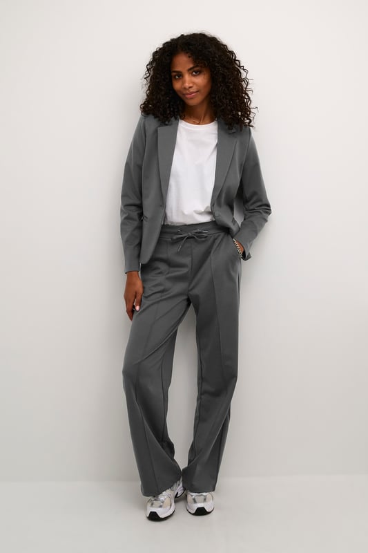 Regular fit,Elastische Taille,Lang,Weite leg  30° waschbar, Nicht bleichen, Nicht im Trockner trocknen, Tropnass aufhängen im Schatten, Kalt bügeln max. 110° C, Trockenreinigung  76% Polyester (Recycelt),20% Viskose,4% Elasthan