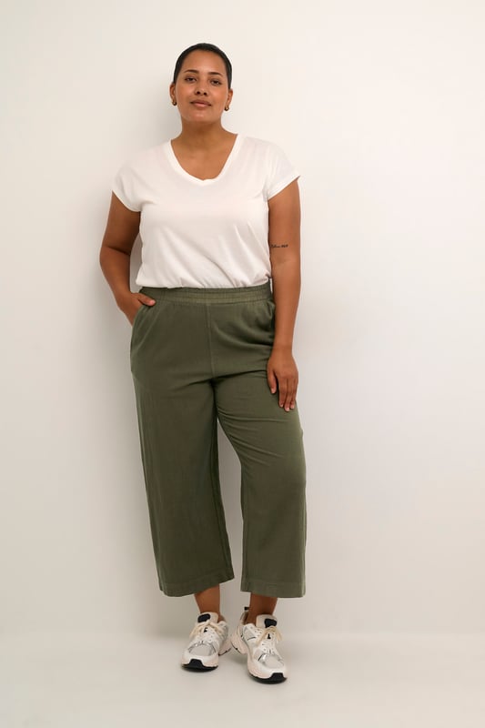 Loose fit,Elastische Taille,Knöchellänge,Weite leg  30° waschbar, Nicht bleichen, Trocknen im Trockner schonend, Tropnass aufhängen im Schatten, Warm bügeln max. 150° C, Trockenreinigung  100% Baumwolle
