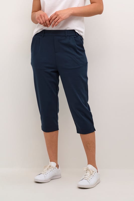 Regular fit,Elastische taille,Onder de knie,Slim  Wassen op 30°, niet bleken, niet in de droger drogen, Druipnat ophangen in de schaduw, koud strijken max. 110° C, Droogreiniging  76% Polyester (Gerecycled),20% Viscose,4% Elastaan