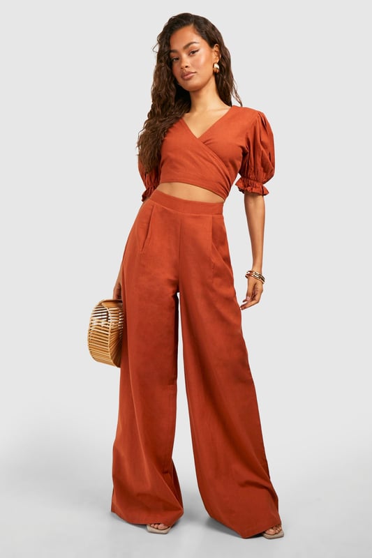 Wide leg design for a relaxed, breezy silhouette
        High-waisted fit accentuates the waistline
        Linen-look fabric offers a lightweight, breathable feel
        Side pockets add functionality to the stylish design
        Versatile trousers suitable for various casual occasions
    
    Embrace effortless chic with these wide leg relaxed fit trousers from Boohoo. The linen-look fabric lends a laid-back, summery vibe to your ensemble, perfect for those balmy days and casual outings. Style these trousers with a cropped wrap top for a coordinated look that's both trendy and comfortable. The high-waisted design flatters your figure, while the relaxed fit through the legs ensures unrestricted movement. Pair with flat sandals for a day of shopping or dress up with wedges for a casual dinner date. These trousers are a versatile addition to your wardrobe, easily transitioning from beachside strolls to family gatherings. The side pockets offer practicality without compromising on style. For a complete look, accessorise with oversized sunglasses and a woven tote bag, channelling that effortless British summer style.