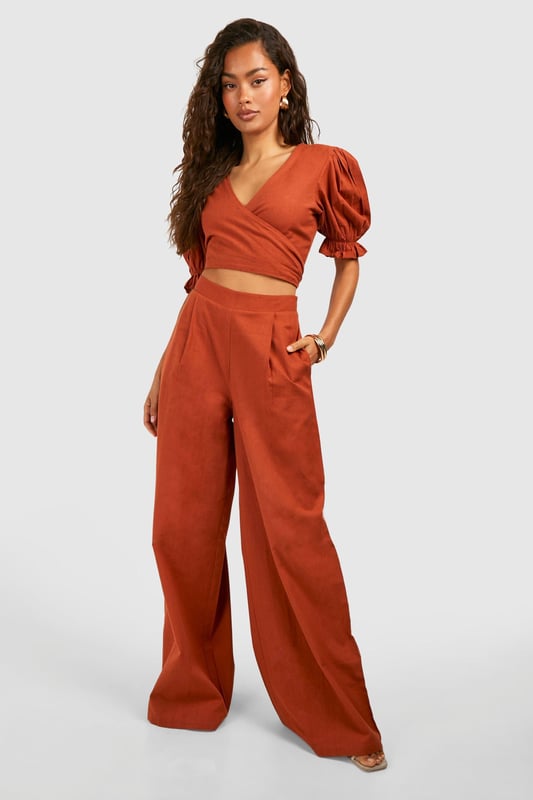 Wide leg design for a relaxed, breezy silhouette
        High-waisted fit accentuates the waistline
        Linen-look fabric offers a lightweight, breathable feel
        Side pockets add functionality to the stylish design
        Versatile trousers suitable for various casual occasions
    
    Embrace effortless chic with these wide leg relaxed fit trousers from Boohoo. The linen-look fabric lends a laid-back, summery vibe to your ensemble, perfect for those balmy days and casual outings. Style these trousers with a cropped wrap top for a coordinated look that's both trendy and comfortable. The high-waisted design flatters your figure, while the relaxed fit through the legs ensures unrestricted movement. Pair with flat sandals for a day of shopping or dress up with wedges for a casual dinner date. These trousers are a versatile addition to your wardrobe, easily transitioning from beachside strolls to family gatherings. The side pockets offer practicality without compromising on style. For a complete look, accessorise with oversized sunglasses and a woven tote bag, channelling that effortless British summer style.