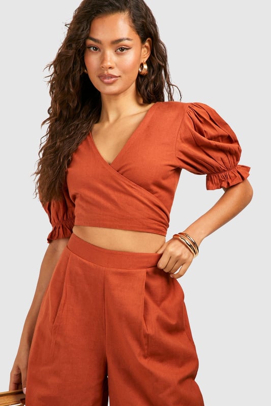 Wide leg design for a relaxed, breezy silhouette
        High-waisted fit accentuates the waistline
        Linen-look fabric offers a lightweight, breathable feel
        Side pockets add functionality to the stylish design
        Versatile trousers suitable for various casual occasions
    
    Embrace effortless chic with these wide leg relaxed fit trousers from Boohoo. The linen-look fabric lends a laid-back, summery vibe to your ensemble, perfect for those balmy days and casual outings. Style these trousers with a cropped wrap top for a coordinated look that's both trendy and comfortable. The high-waisted design flatters your figure, while the relaxed fit through the legs ensures unrestricted movement. Pair with flat sandals for a day of shopping or dress up with wedges for a casual dinner date. These trousers are a versatile addition to your wardrobe, easily transitioning from beachside strolls to family gatherings. The side pockets offer practicality without compromising on style. For a complete look, accessorise with oversized sunglasses and a woven tote bag, channelling that effortless British summer style.
