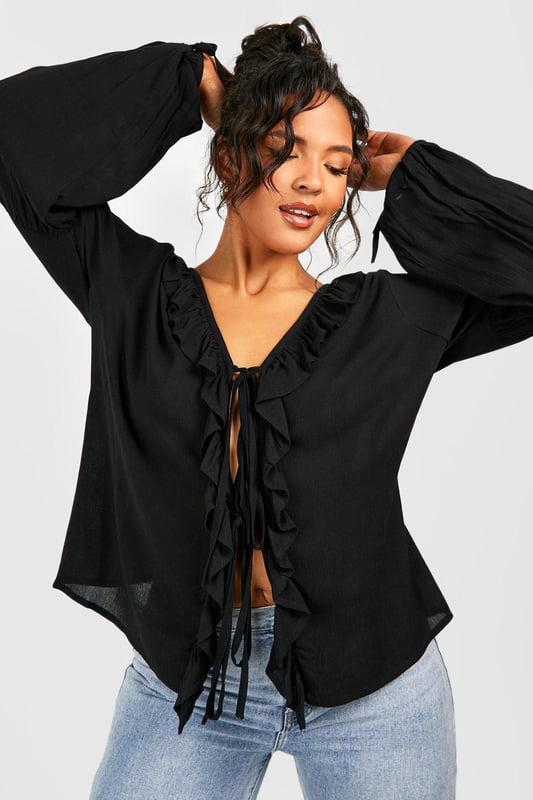A certified wardrobe hero we can't live without, cause a storm this season in this plus size blouse from our latest collection. A smart, tailored style cut off above the waist to accentuate your curves, this floaty style can be dressed up or down, depending on the vibe. Want that 'jeans and a nice top' look? Wear a plus size white blouse with your high waisted denim and some chunky trainers and your weekend uniform is set. Detail is key with this one, that's why we're loving plus size ruffle blouses to add texture to an everyday look.Style: BlouseDesign: PlainFabric: CheeseclothLength: RegularNeckline: PlungeSleeve Length: Long Sleeve