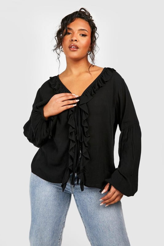 A certified wardrobe hero we can't live without, cause a storm this season in this plus size blouse from our latest collection. A smart, tailored style cut off above the waist to accentuate your curves, this floaty style can be dressed up or down, depending on the vibe. Want that 'jeans and a nice top' look? Wear a plus size white blouse with your high waisted denim and some chunky trainers and your weekend uniform is set. Detail is key with this one, that's why we're loving plus size ruffle blouses to add texture to an everyday look.Style: BlouseDesign: PlainFabric: CheeseclothLength: RegularNeckline: PlungeSleeve Length: Long Sleeve