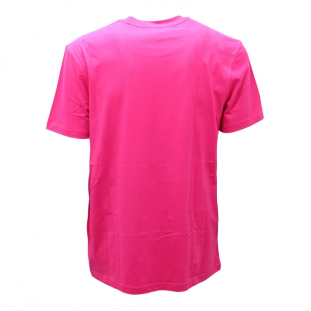 The Moschino Couture Gloss Logo Fuxia T-Shirt in vibrant pink is a bold addition to any modern man's wardrobe. Featuring the signature Moschino logo in a striking gloss finish, this T-shirt effortlessly blends luxury with street style. Crafted from high-quality materials, it ensures a comfortable fit that moves with you throughout the day. Whether paired with jeans for a casual look or layered under a jacket for a night out, this T-shirt makes a confident statement. Embrace standout style and showcase your fashion-forward attitude with this iconic Moschino piece. Made in Portugal, 100% Cotton