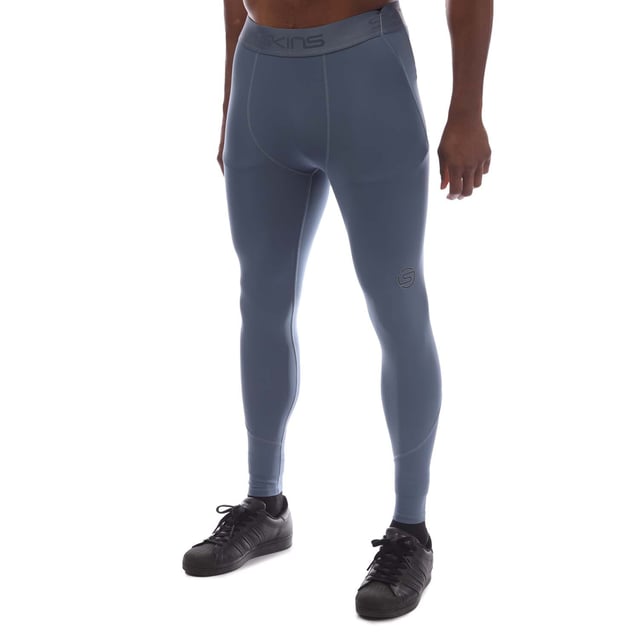 Mens Skins Series-2 Long Tights in blue.- Branded elasticated waistband.- Reflective outline logos.- Squat proof.- Great absorbency and wicking qualities.- 83% Polyester  17% Elastane.- Ref: SW00200010575