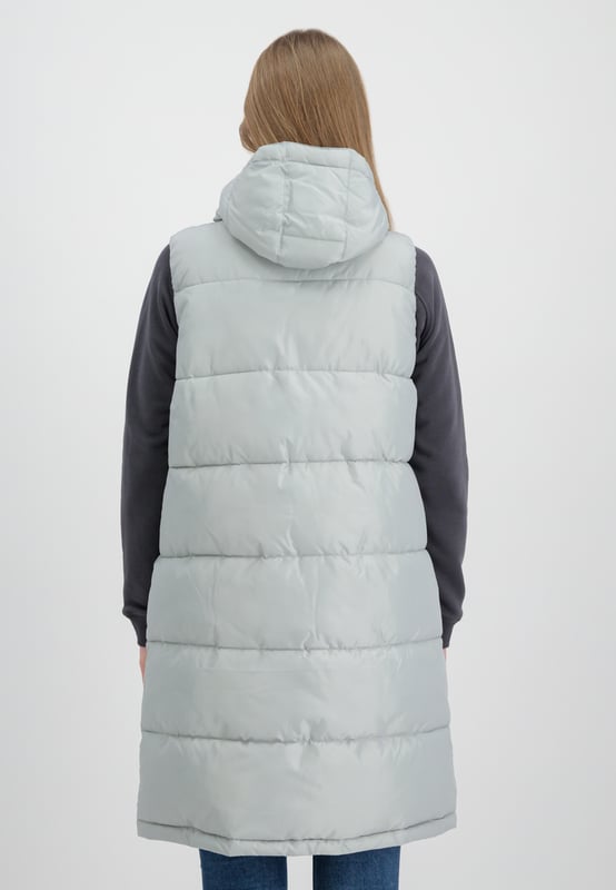Long Puffer Vest Women This is the Alpha Industries Long Puffer Vest for women. This vest features an adjustable hood and a practical inner pocket, and is padded for extra insulation. The regular fit provides exceptional comfort throughout the day.