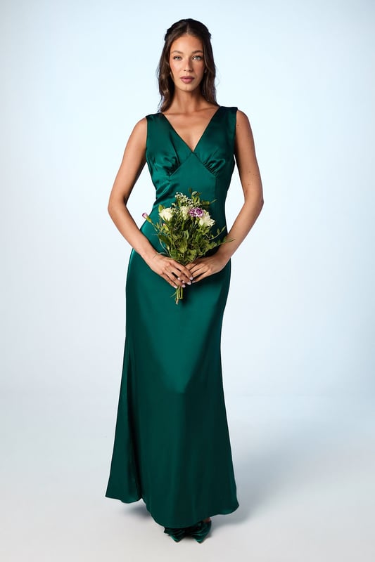 Refined and classically elegant, this maxi dress was made to flatter and enhance every woman's figure. Featuring a dramatic bow at the back to tie the design and give it a fresh note of playfulness. Made from Olivia satin: exuding a lustrous sheen, this satin fabric balances structure and fluidity with masterful perfection, achieving a curated silhouette whatever the style. Level of stretch: little. This dress fastens with a rear concealed zip. Perfect for a town hall wedding. ?